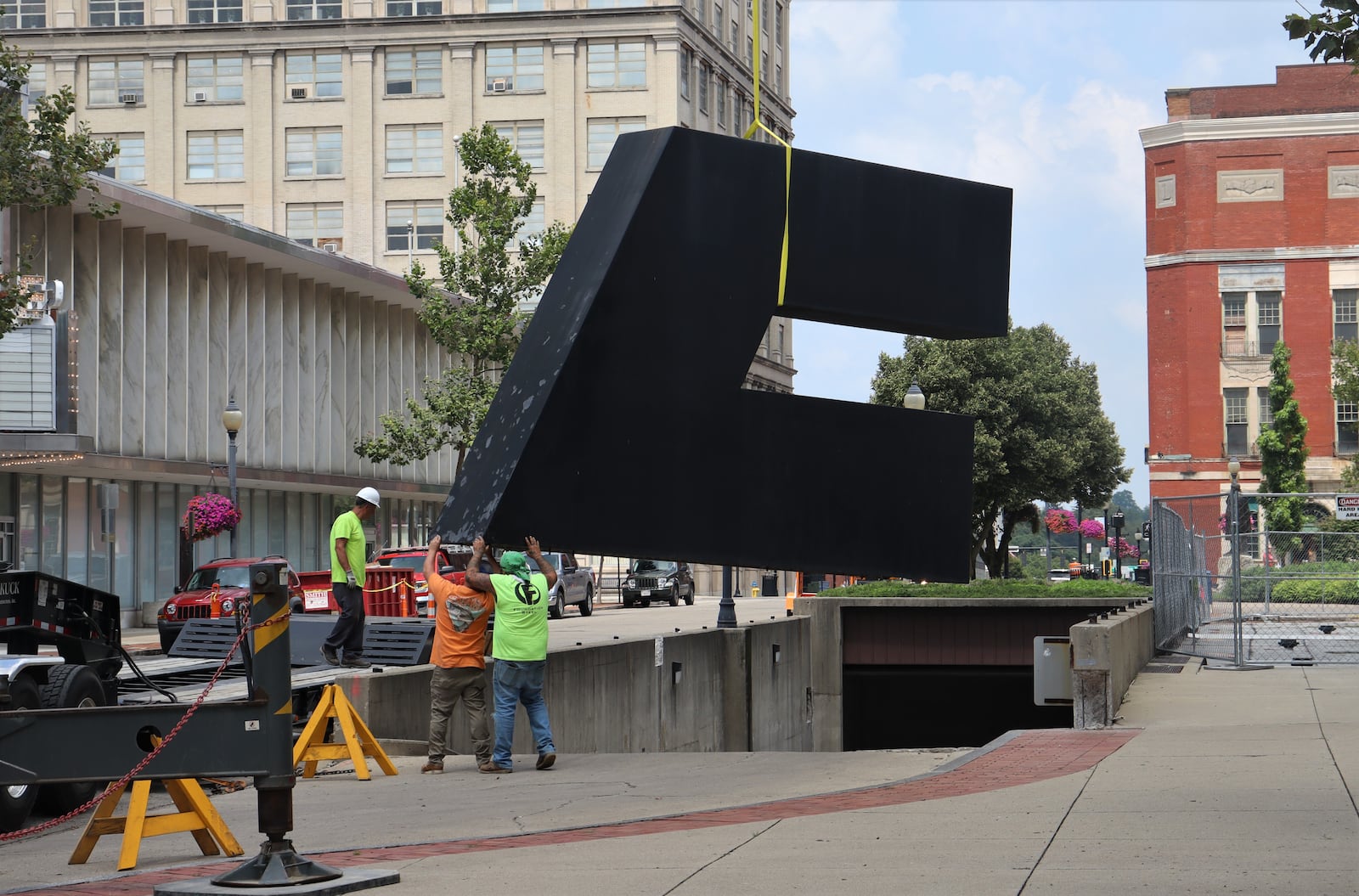 A piece of Oracle's Vision, a decades-old sculpture in front of Springfield City Hall, was loaded onto a flatbed truck and placed into storage Wednesday, Aug. 16, 2023. JESSICA OROZCO/STAFF