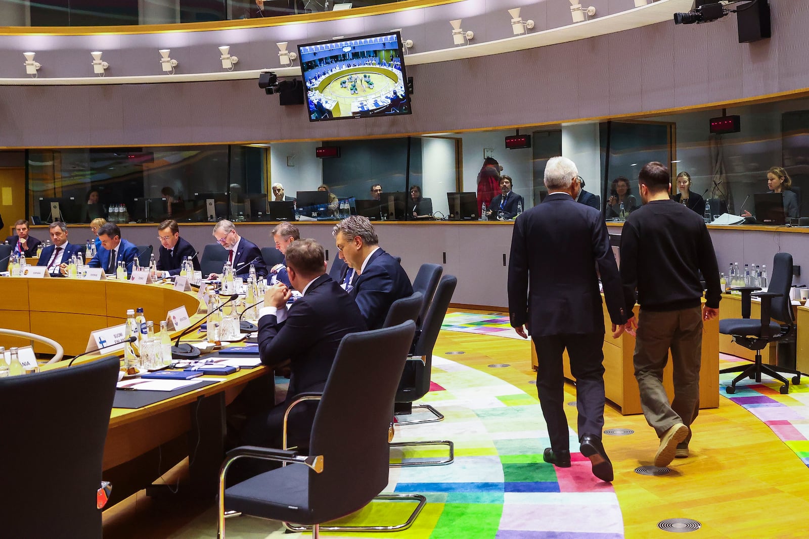 Ukraine's President Volodymyr Zelenskyy, right, and European Council President Antonio Costa arrives for a round table meeting during an EU summit in Brussels on Thursday, Dec. 19, 2024. (Johanna Geron, Pool Photo via AP)