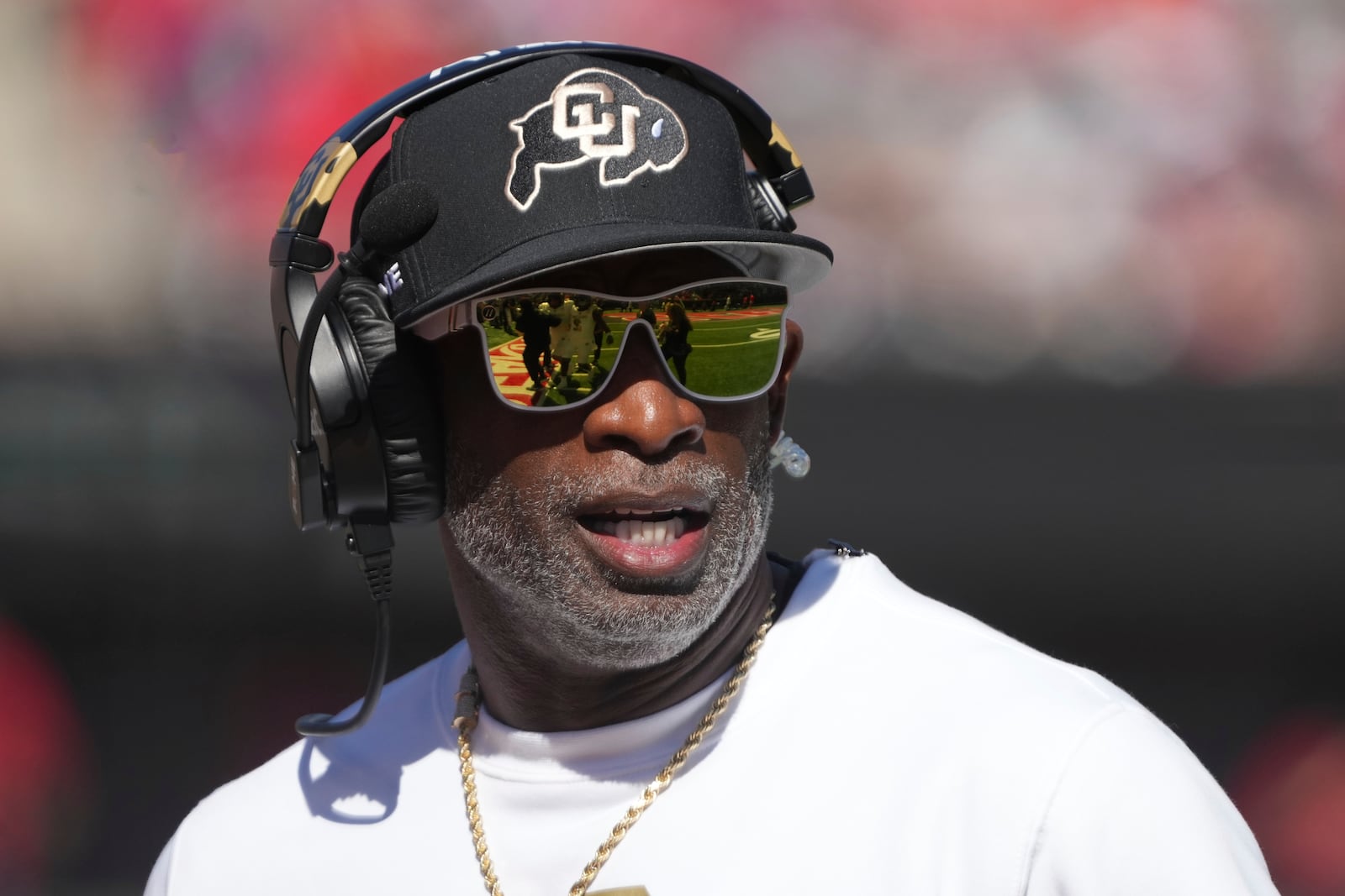 FILE - Colorado head coach Deion Sanders watches the replay in the first half during an NCAA college football game against Arizona, Oct. 19, 2024, in Tucson, Ariz. (AP Photo/Rick Scuteri, file)