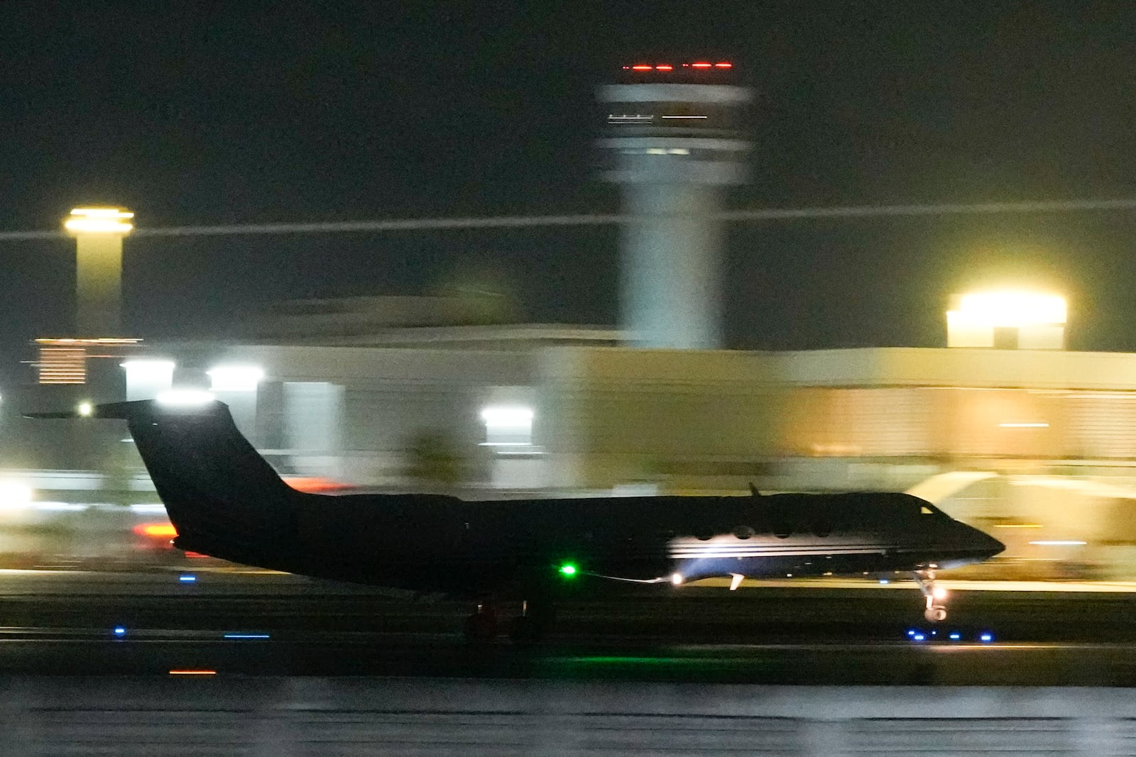 FILE - A plane carrying former Philippine President Rodrigo Duterte to The Hague takes off in Manila, Philippines on Tuesday, March 11, 2025. (AP Photo/Aaron Favila, File)