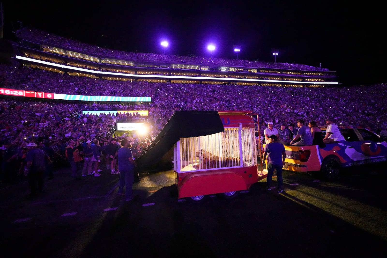 A live tiger is rolled into Tiger Stadium before an NCAA college football game between LSU and Alabama in Baton Rouge, La., Saturday, Nov. 9, 2024. (AP Photo/Gerald Herbert)