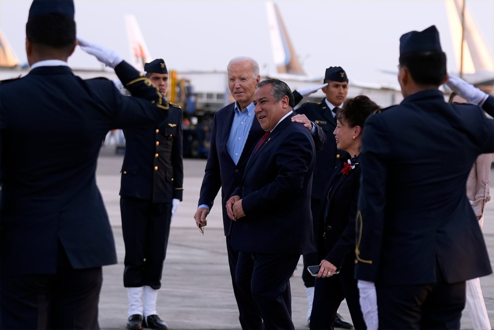 President Joe Biden walks with Peru's Prime Minister Gustavo Adrianzen as he arrives at Jorge Chavez International Airport in Lima, Peru, Thursday, Nov. 14, 2024, to attend the APEC Summit. (AP Photo/Manuel Balce Ceneta)