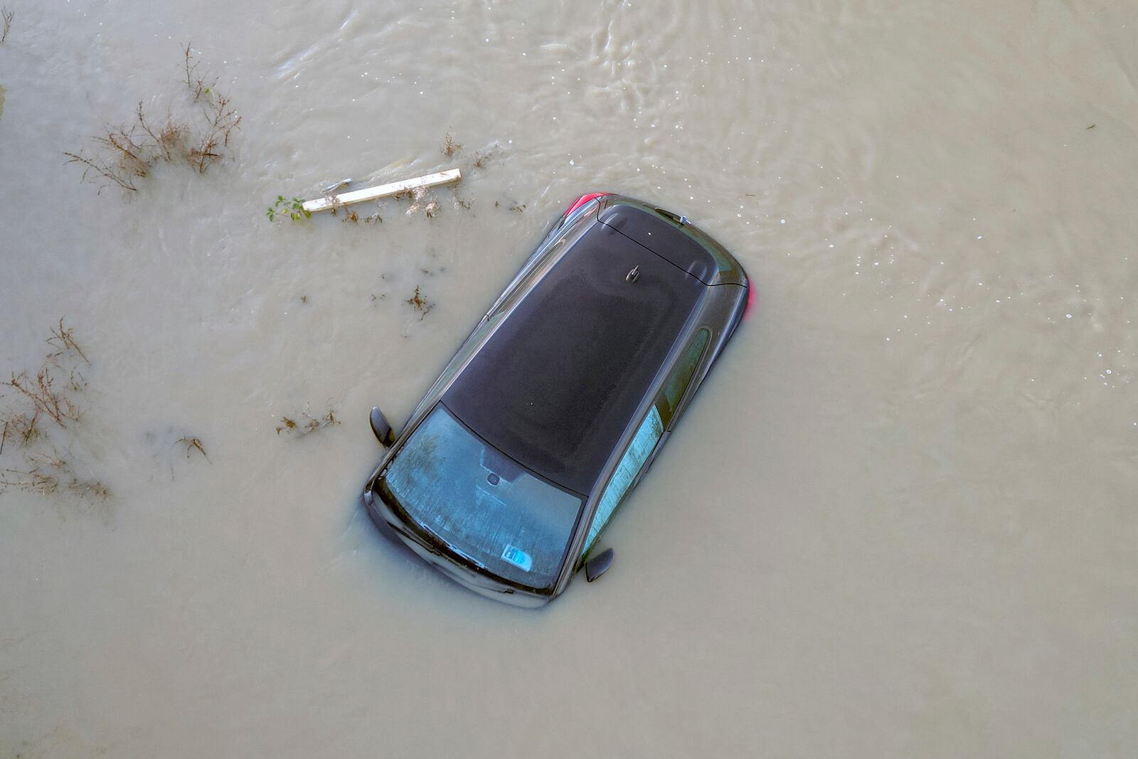 A car sits in the floods of the river Soar in Barrow Upon Soar, England, Tuesday, Jan. 7, 2025.(AP Photo/Darren Staples)