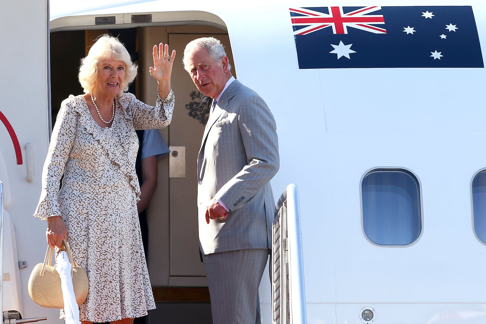 FILE - Britain's Prince Charles, right, and his wife Camilla, Duchess of Cornwall, wave as they prepare to depart Perth, Australia, on Nov. 15, 2015. (Paul Kane/Pool Photo via AP, File )