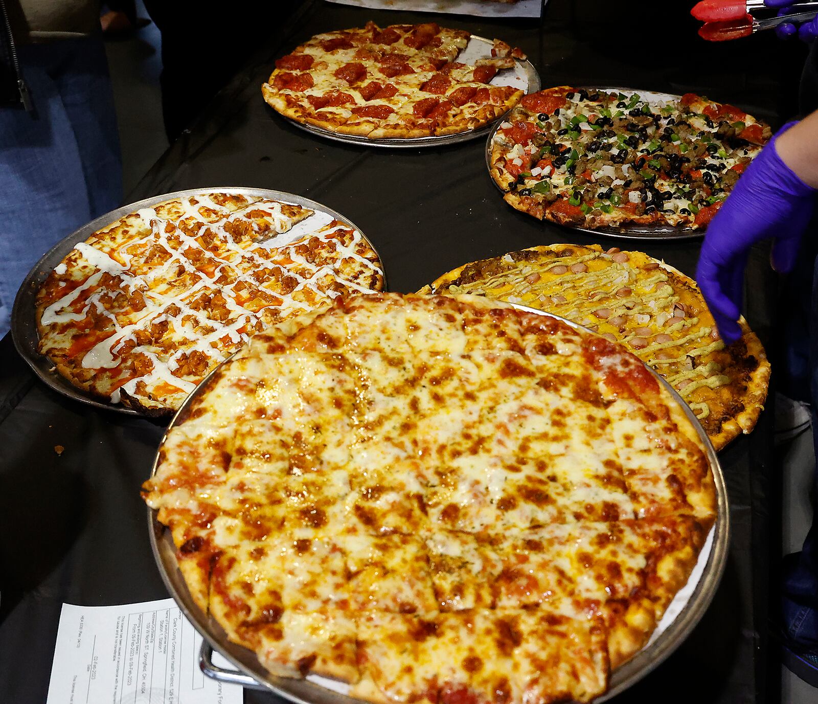 Some of the best pizza places in Clark County went head-to-head Thursday Feb. 9, 2023 to see who was supreme in the Slice of Springfield competition at Mother Stewart's Brewery. Hundreds of people were in attendance to sample pizza from each of the competitors and vote on their favorite. The event, sponsored by Mother Stewart's, National Trail Parks and Recreation District and Partners for the Parks, featured pizza from The Hickory Inn, Crust & Company, Buckeye Barn, Mikey's Pizza, Station #1, Fent's Dairy, Catawba General Store and Mike & Rosy's Deli. BILL LACKEY/STAFF