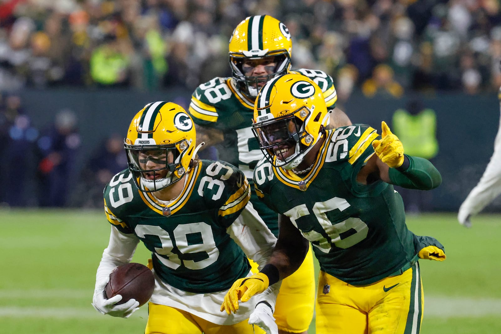 Green Bay Packers safety Zayne Anderson (39) celebrates his interception during the second half of an NFL football game against the New Orleans Saints, Monday, Dec. 23, 2024, in Green Bay, Wis. (AP Photo/Mike Roemer)