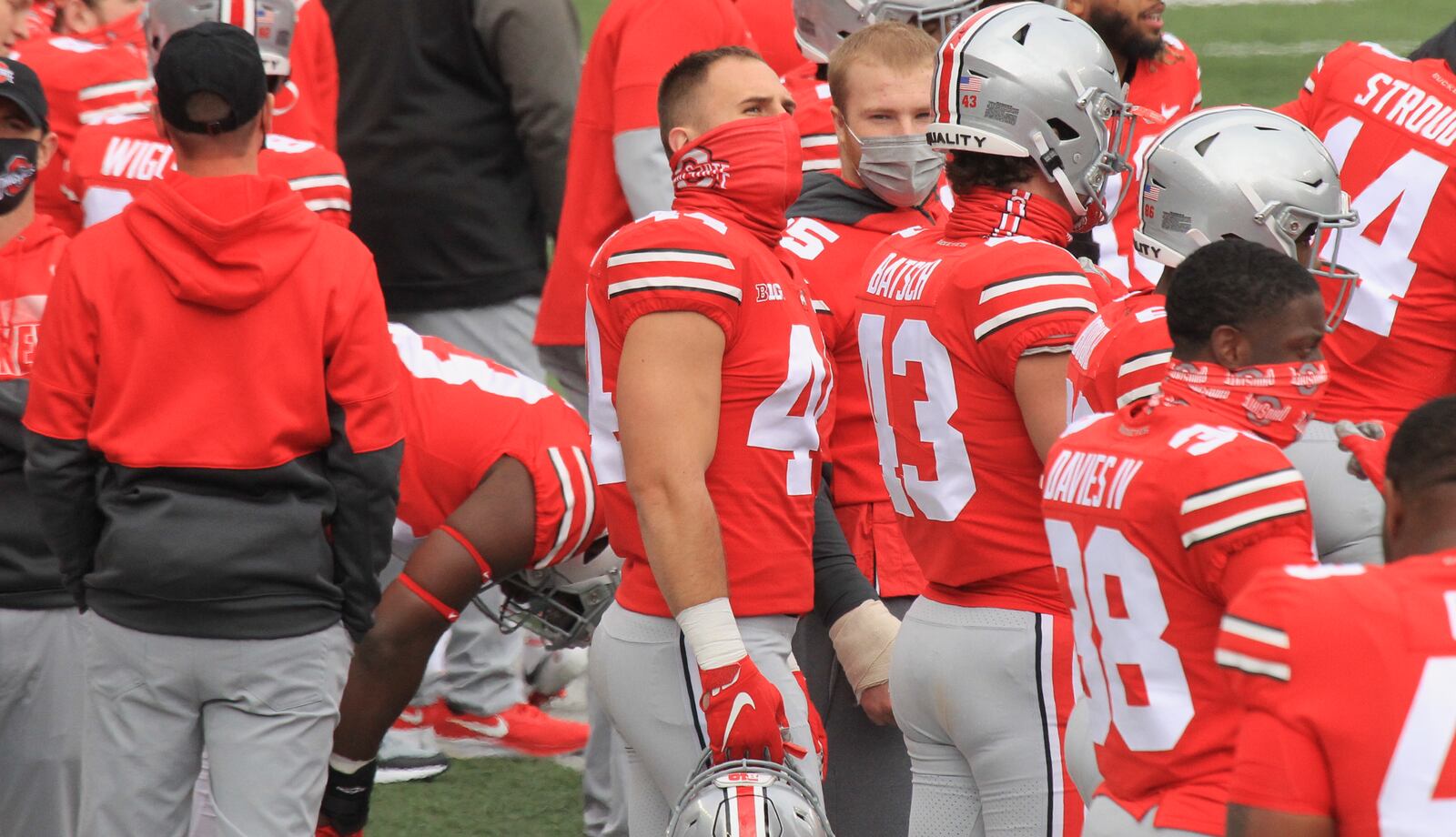 Ohio State's Ben Schmiesing, center, stands on the sideline during Ohio State's game against Nebraska on Saturday, Oct. 24, 2020, at Ohio Stadium in Columbus. David Jablonski/Staff