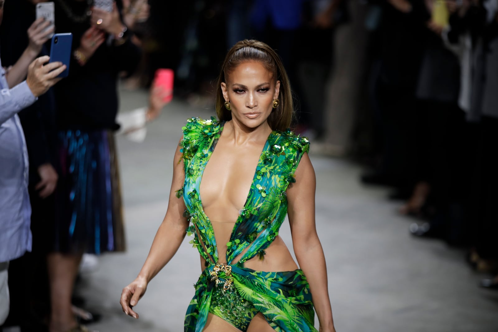 FILE - Actress Jennifer Lopez wears a creation as part of the Versace Spring-Summer 2020 collection, unveiled during the fashion week, in Milan, Italy, Friday, Sept. 20, 2019. (AP Photo/Luca Bruno, File)