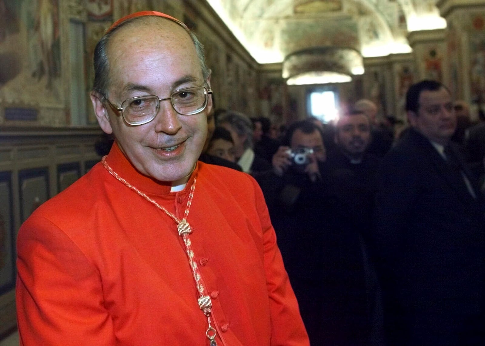 FILE - Cardinal Juan Luis Cipriani Thorne, Archbishop of Lima, Peru, smiles during courtesy calls in the Paul VI Hall at the Vatican, after being elevated cardinal at the Consistory led by Pope John Paul II, Feb. 21, 2001. (AP Photo/Jerome Delay, File)