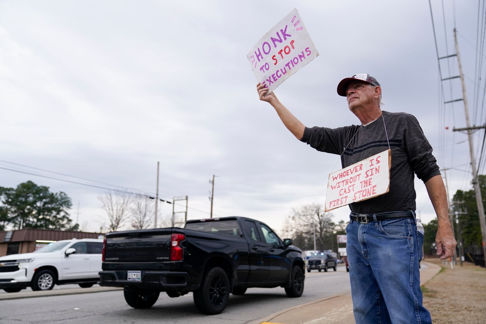 Bucky Bruce protests prior to the scheduled execution of Marion Bowman Jr. outside of a South Carolina Department of Corrections facility, Friday, Jan. 31, 2025, in Columbia, S.C. (AP Photo/Erik Verduzco)