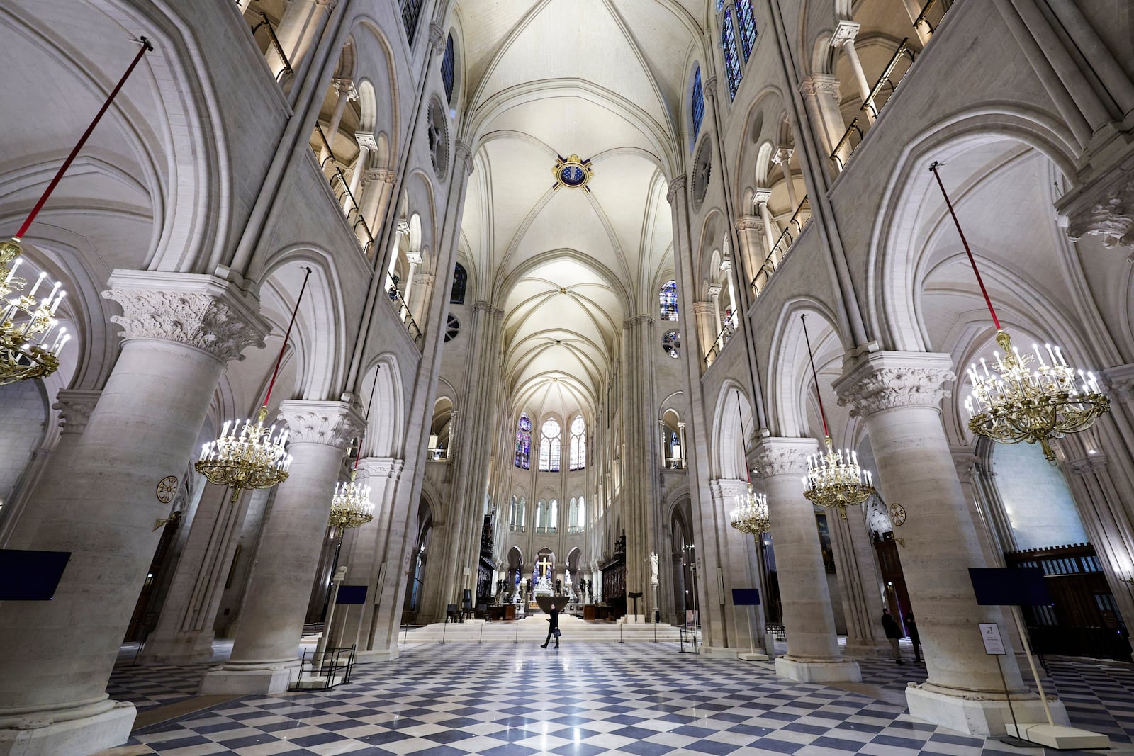 The nave of Notre-Dame de Paris cathedral is seen while French President Emmanuel Macron visits the restored interiors of the cathedral, Friday Nov. 29, 2024, in Paris. (Stephane de Sakutin, Pool via AP)