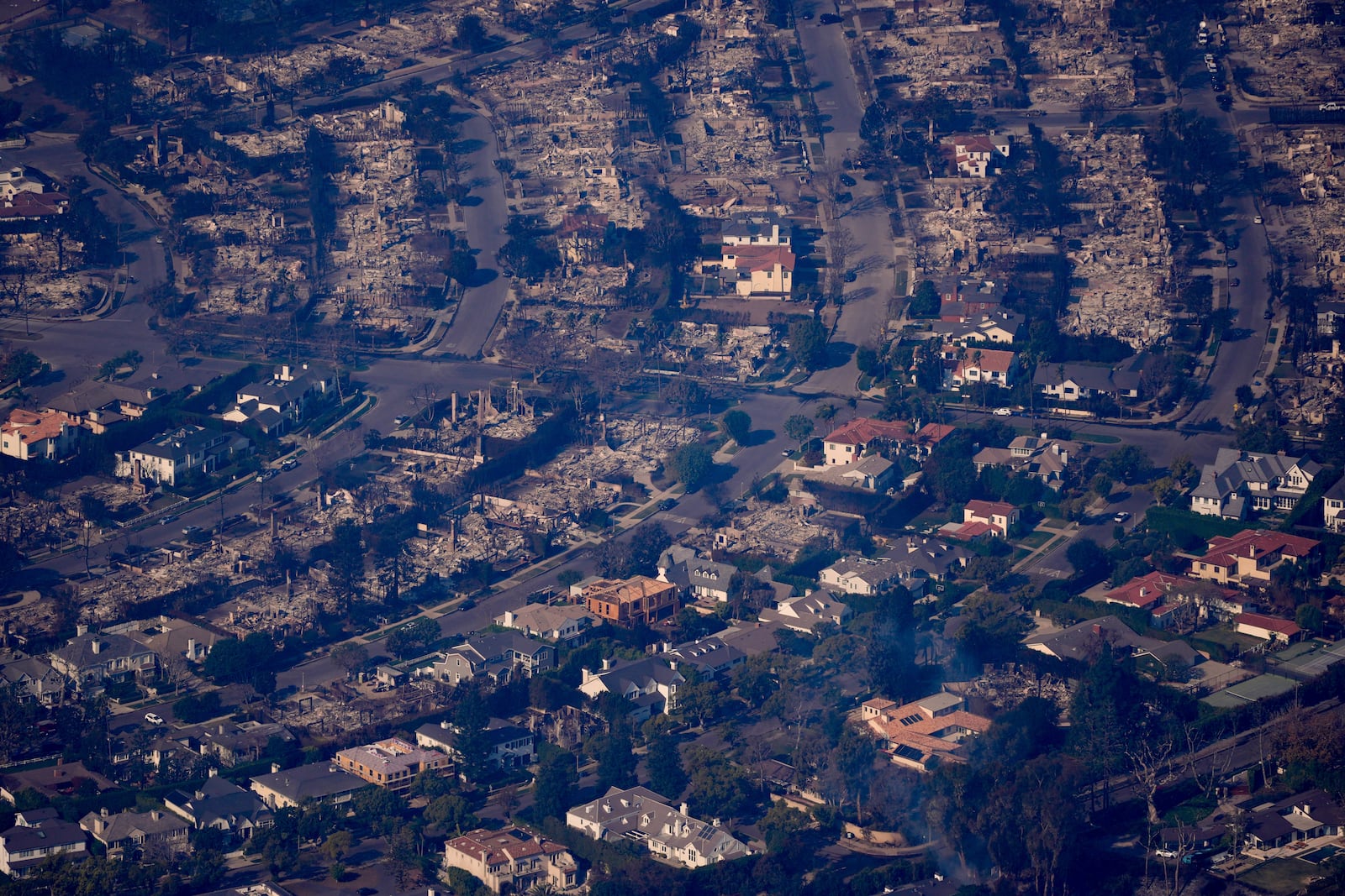 The devastation from the Palisades Fire is seen from the air in the Pacific Palisades neighborhood of Los Angeles, Thursday, Jan. 9, 2025. (AP Photo/Mark J. Terrill)