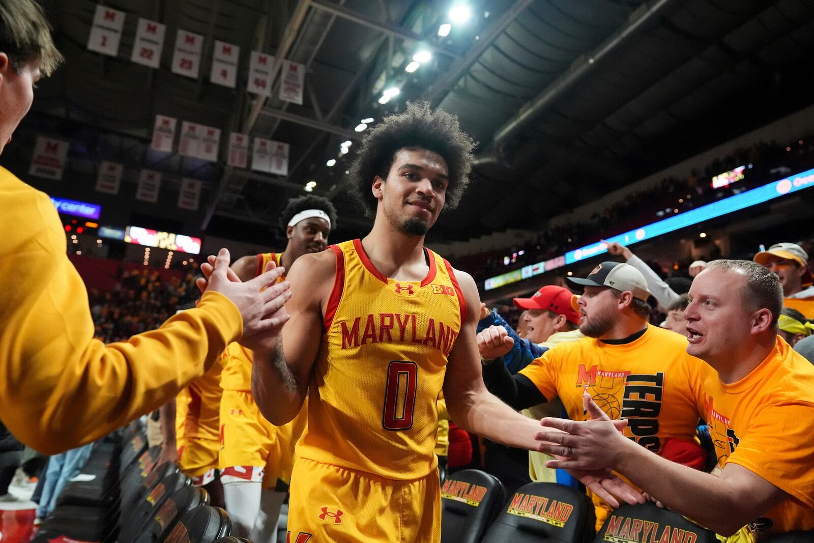 Maryland guard Ja'Kobi Gillespie (0) celebrates his team's victory over Wisconsin with fans after an NCAA college basketball game, Wednesday, Jan. 29, 2025, in College Park, Md. (AP Photo/Stephanie Scarbrough)