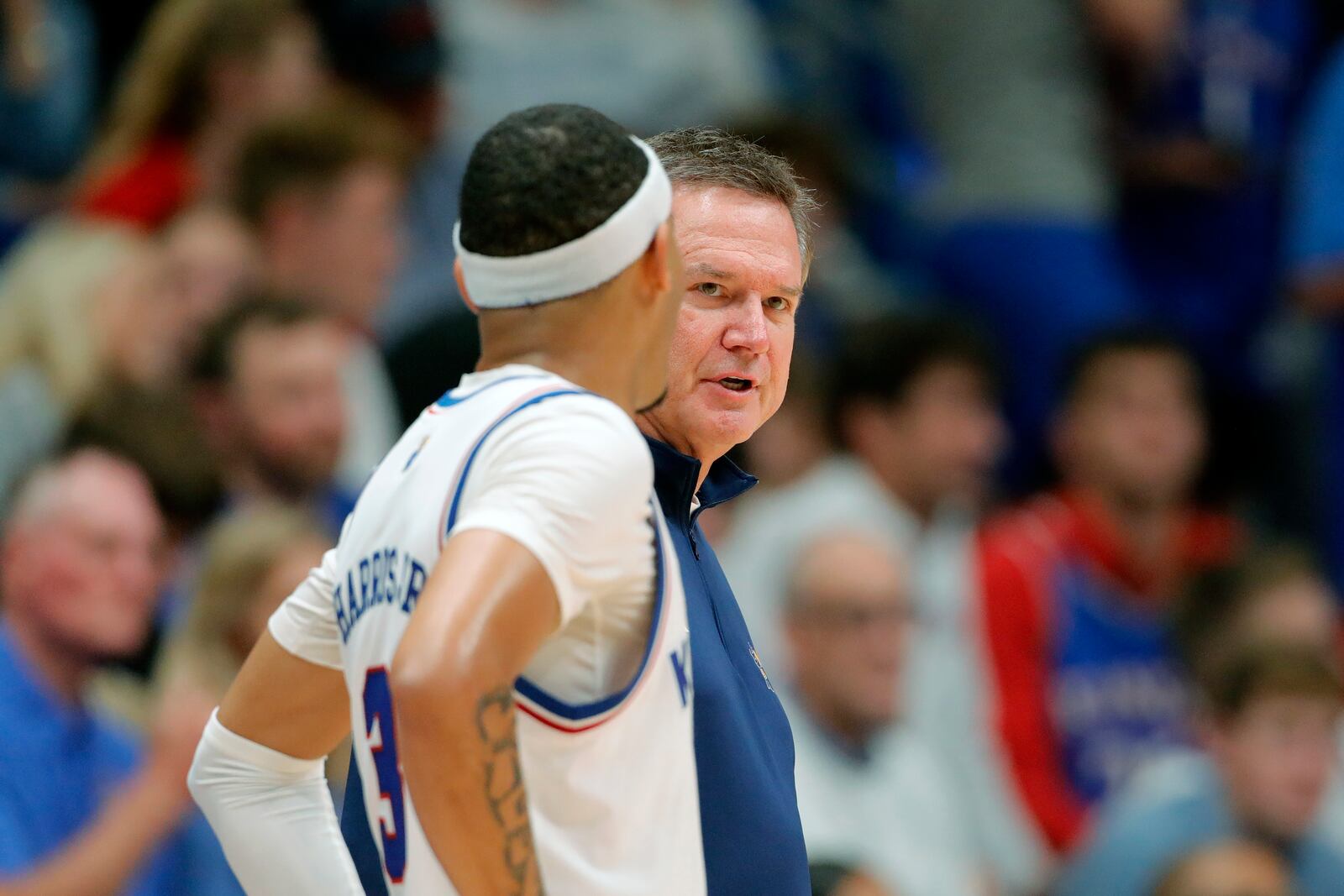 Kansas head coach Bill Self, right, talks with Kansas guard Dajuan Harris Jr. (3) during the second half of an NCAA college basketball game against Howard, Monday, Nov. 4, 2024, in Lawrence, Kan. (AP Photo/Colin E. Braley)