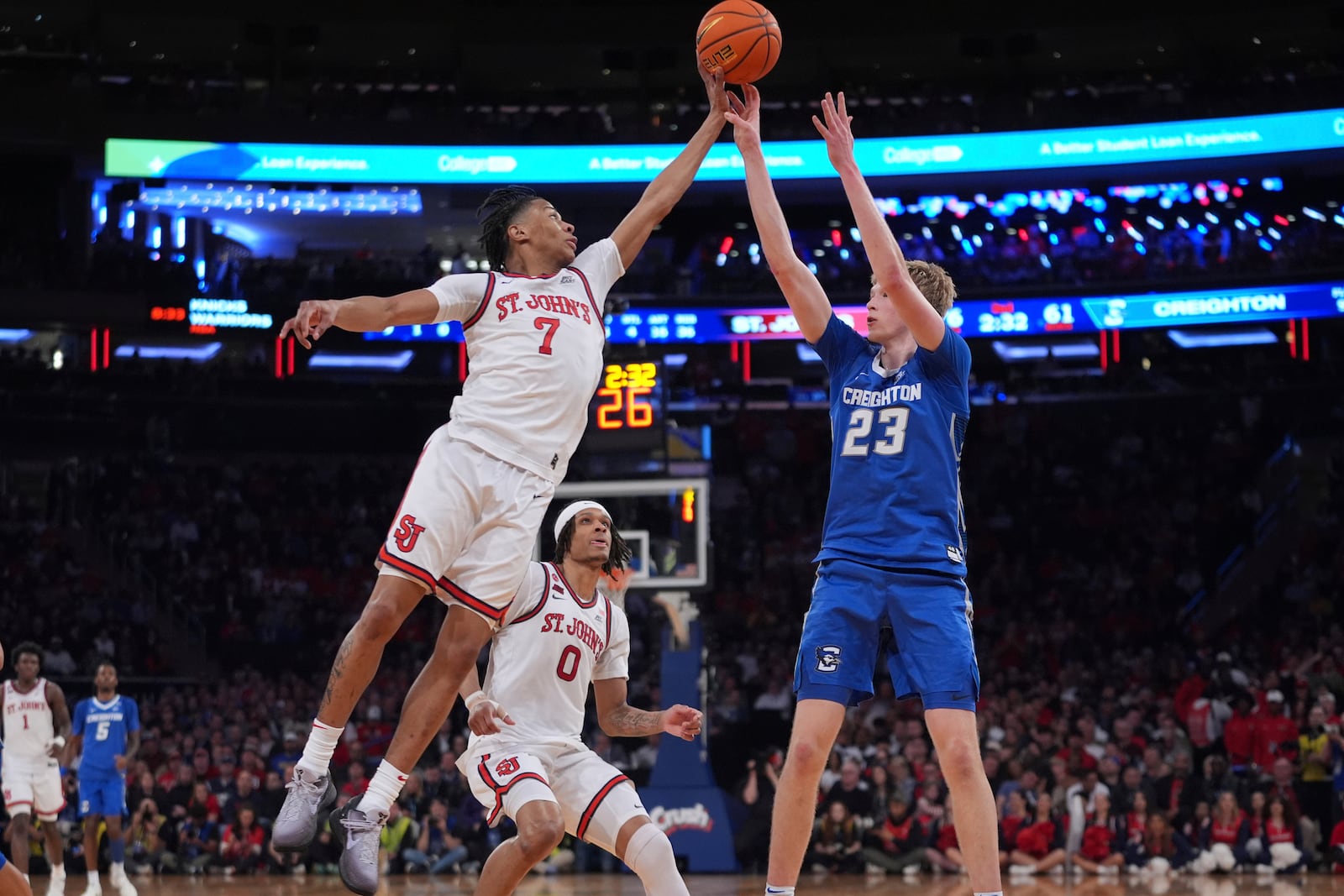 St. John's Simeon Wilcher (7) blocks a shot by Creighton's Jackson McAndrew (23) during the second half of an NCAA college basketball game in the championship of the Big East Conference tournament Saturday, March 15, 2025, in New York. (AP Photo/Frank Franklin II)