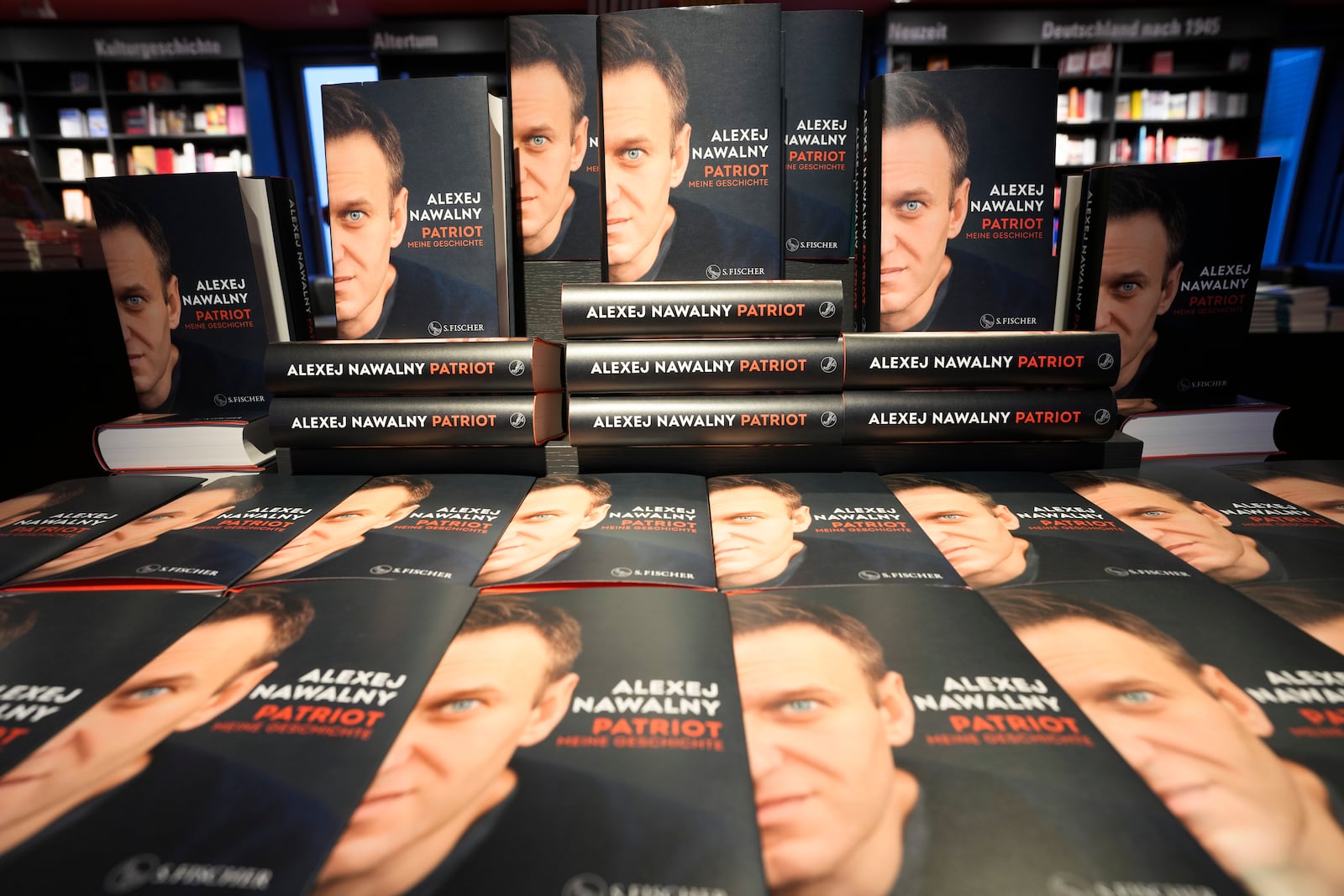 Copies of the late Russian opposition leader Alexei Navalny's memoir entitled 'Patriot' are put display on the first day of sale in a bookshop in Berlin, Germany, Tuesday, Oct. 22, 2024. (AP Photo/Markus Schreiber)