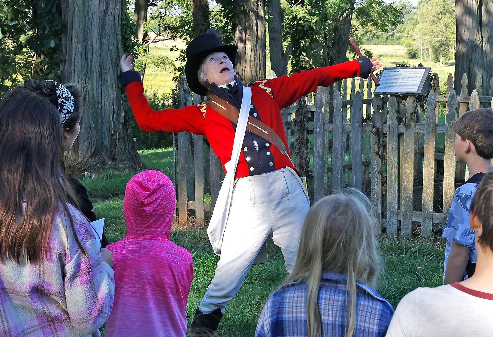 Teresa Savage entertains a group of students Friday, Sept. 1, 2023 during the Fair at New Boston's Education Day. BILL LACKEY/STAFF