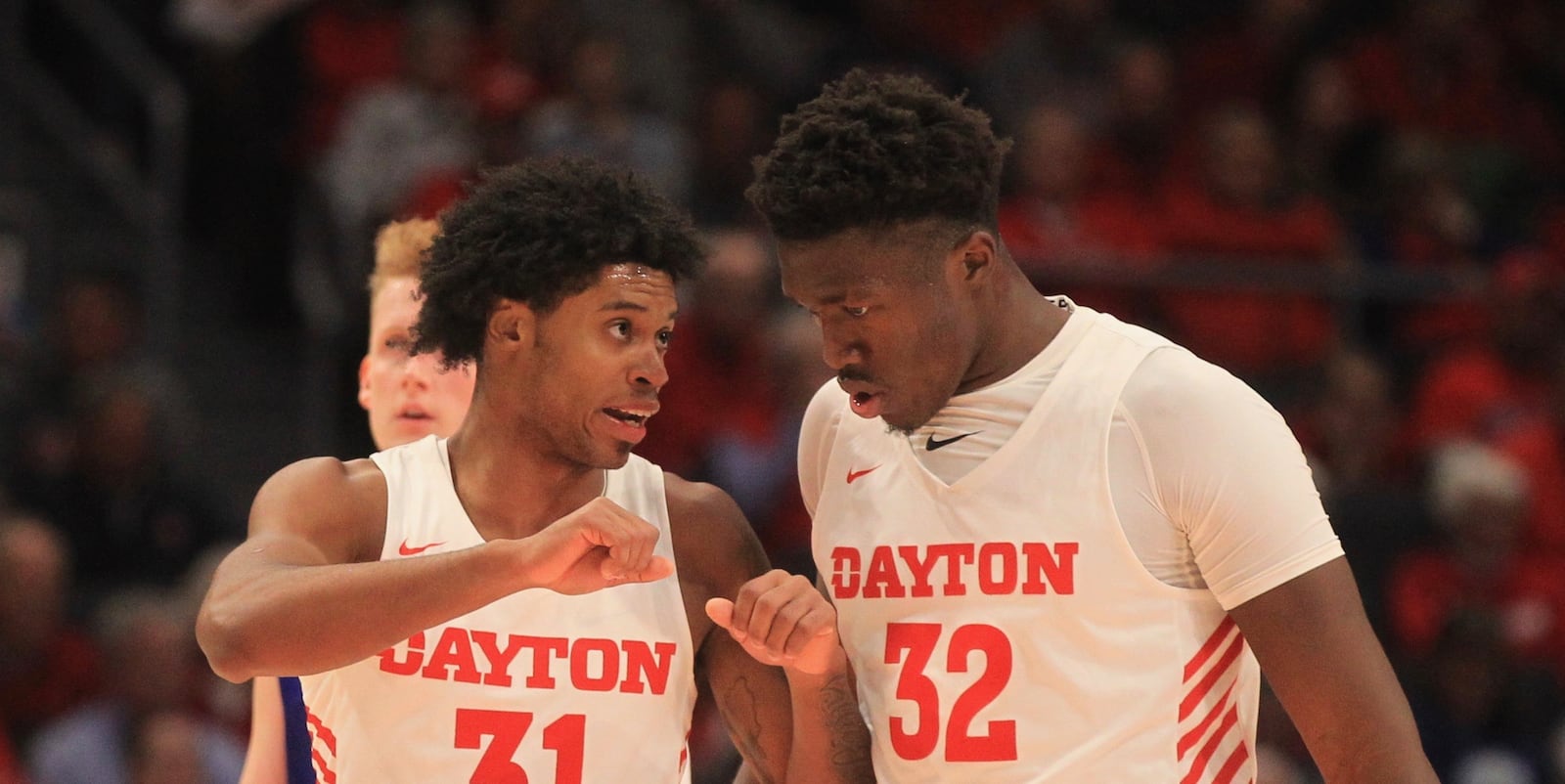 Dayton’s Jhery Matos, left, and Jordy Tshimanga talk during a game against Houston Baptist on Tuesday, Dec. 3, 2019, at UD Arena.