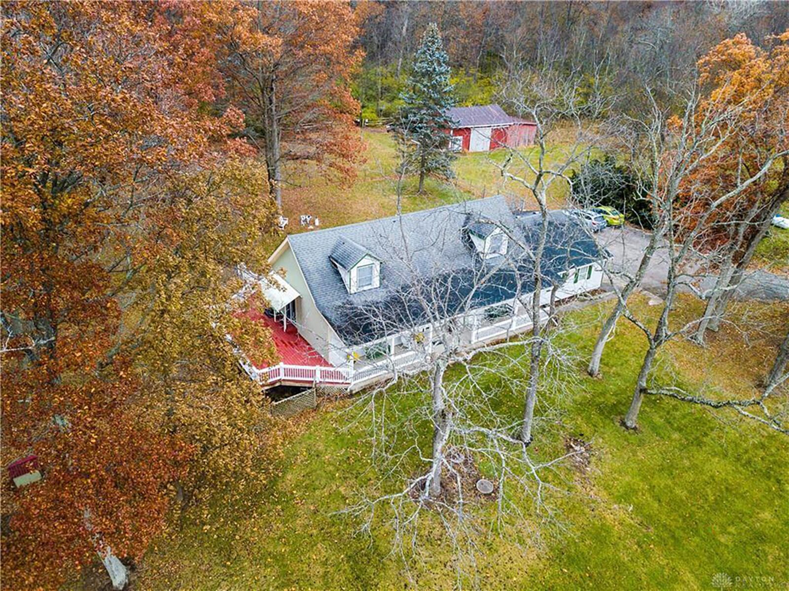 A concrete patio is in back, and the side has a large wood deck with railings and partial fence. The finished basement walks out to the side yard. CONTRIBUTED PHOTO