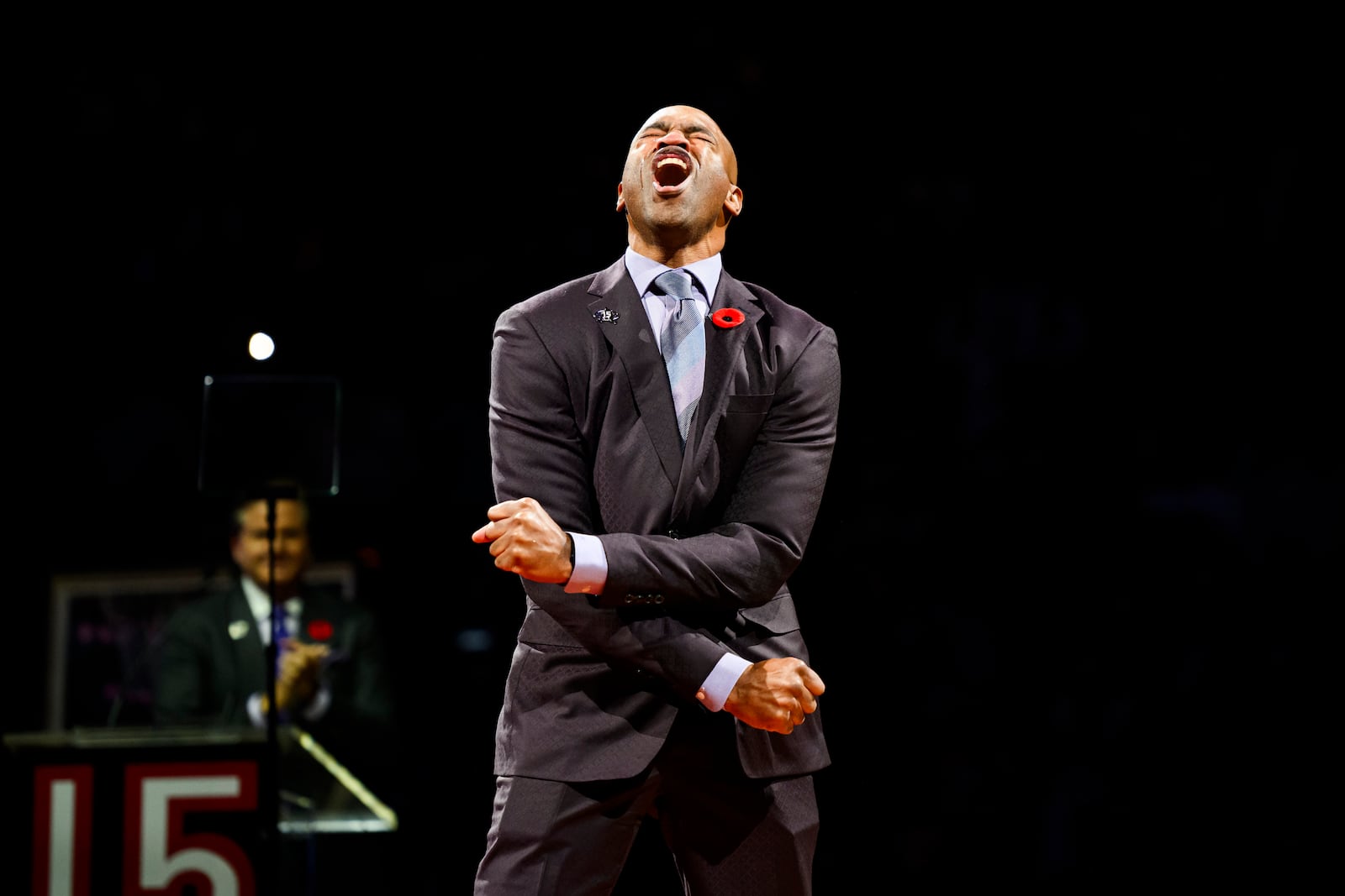 Former Toronto Raptors player Vince Carter reacts during his number retirement ceremony at halftime of an NBA basketball game between the Toronto Raptors and the Sacramento Kings in Toronto on Saturday, Nov. 2, 2024. (Christopher Katsarov/The Canadian Press via AP)