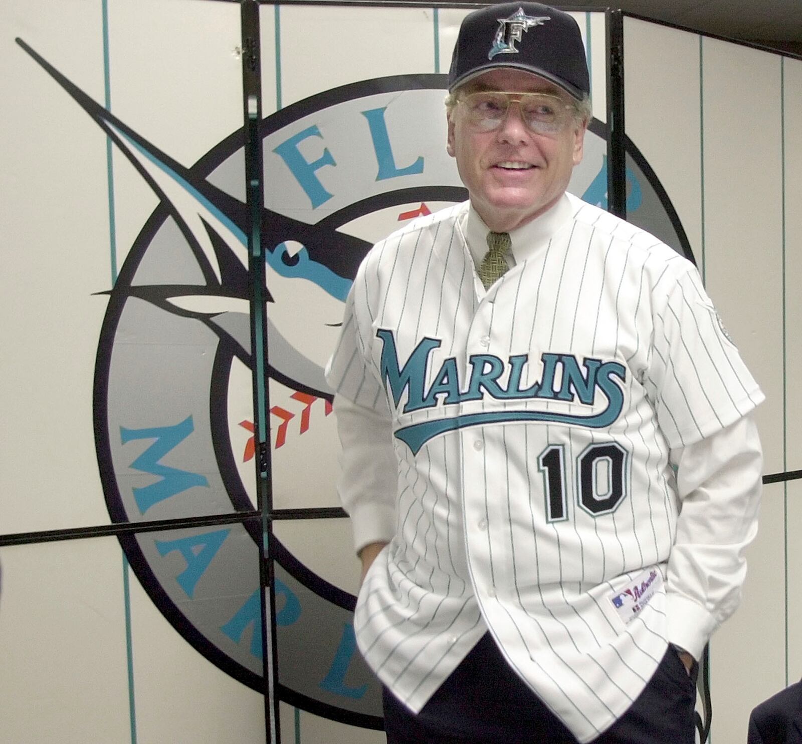 FILE - Jeff Torborg, the new Florida Marlins manager, shows off his jersey and hat following a news conference Thursday, Feb. 14, 2002, at Pro Player Stadium in Miami. (AP Photo/Amy E. Conn, File)