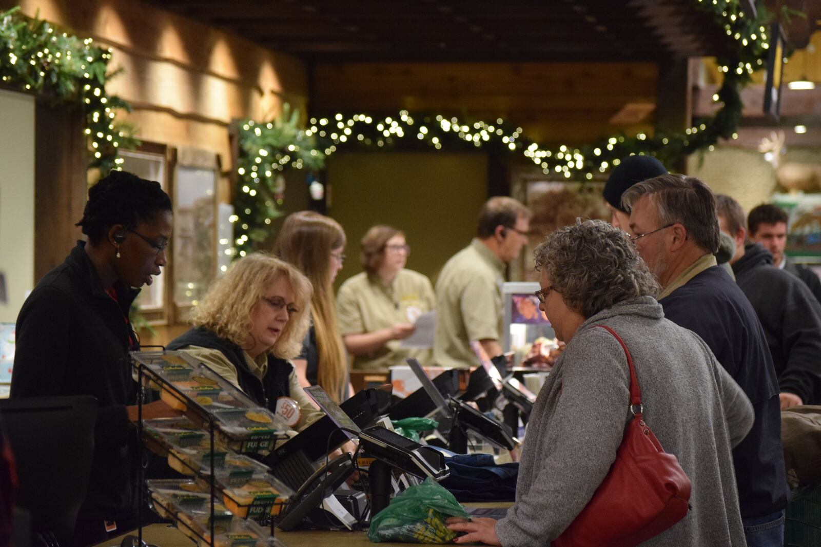 Hundreds of people lined up outside Cabela’s early Friday when doors opened at 5 a.m. The retailer had deals on clothes, guns and other fishing and hunting gifts. STAFF PHOTO / HOLLY SHIVELY