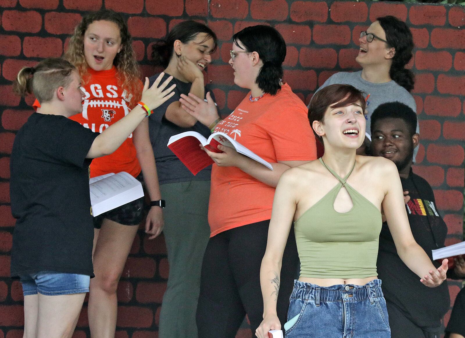 The cast of "Heathers The Musical: High School Edition" rehearse at Veterans Park Amphitheater on July 18, 2022. The cast, members of the Springfield Arts Council's Youth Arts Ambassadors, were rehearsing for a Summer Arts Festival performance. BILL LACKEY/STAFF