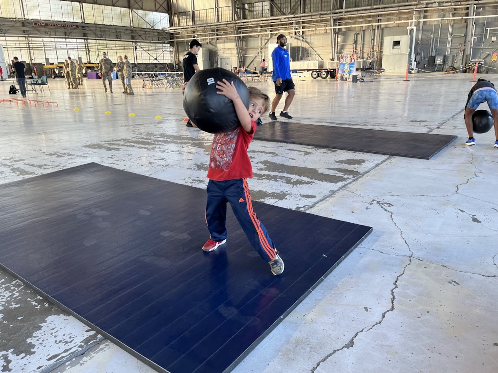 Sebastian Breiding, 5, navigated a physical fitness challenge at Operation K.U.D.O.S. at Wright-Patterson Air Force Base. THOMAS GNAU/STAFF