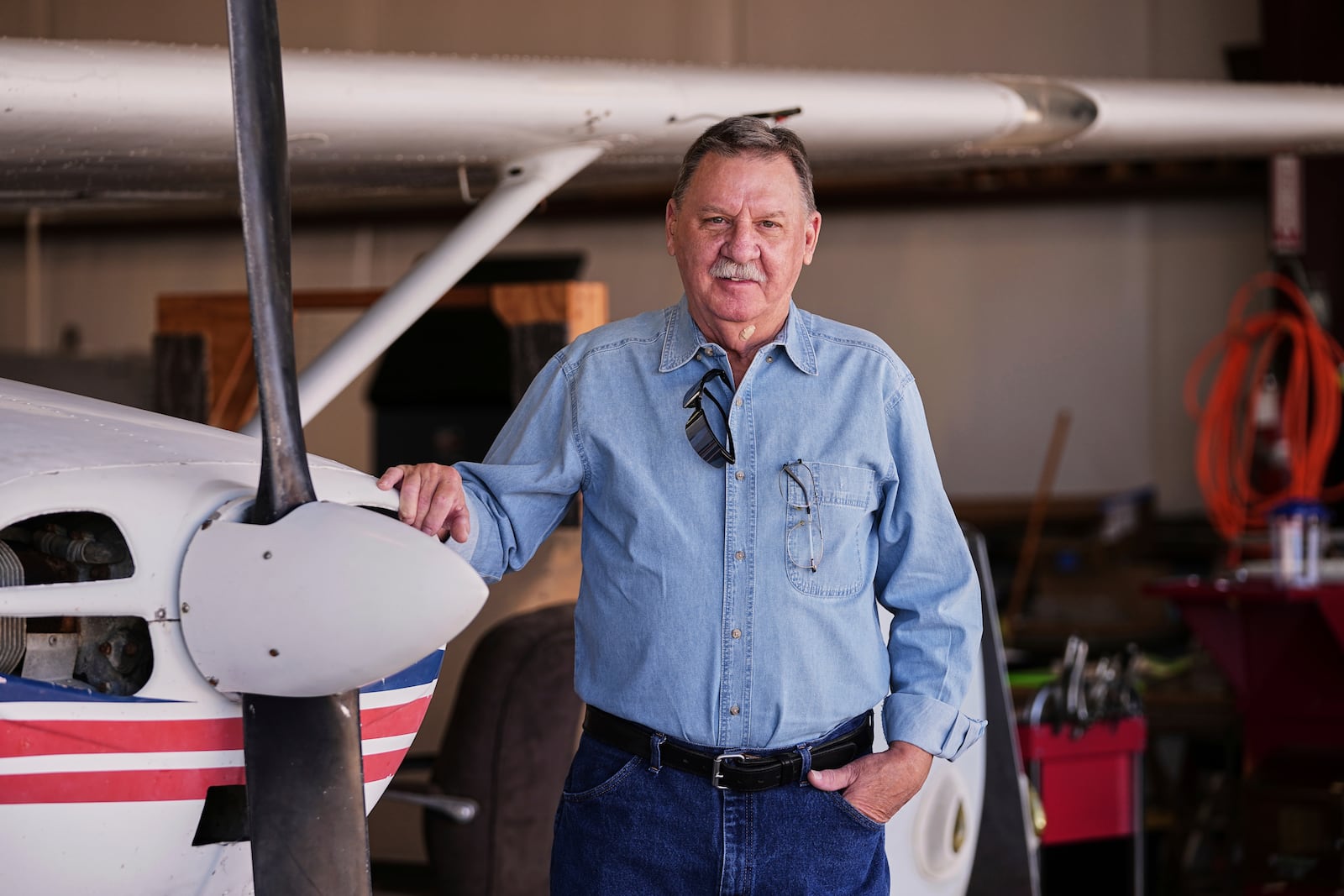 Former Army and Navy Vietnam veteran Richard Lamb, poses for a photo at the EAA Museum at McGregor Executive Airport in McGregor, Texas, Sunday, March 2, 2025. (AP Photo/Tony Gutierrez)