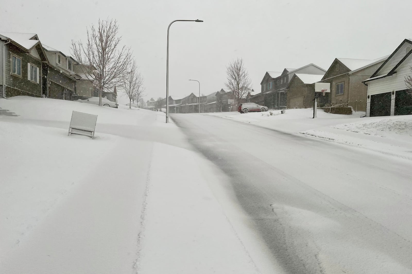 The streets are covered with snow after a storm on Wednesday, March 19, 2025 in Omaha, Neb. (AP Photo/Margery Beck)