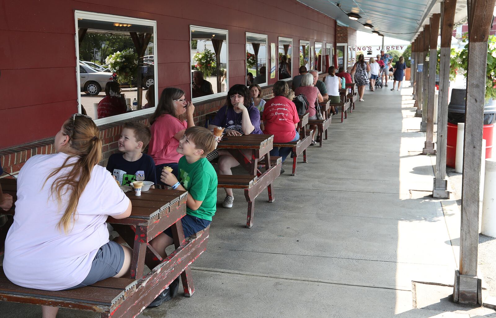 Customers eat outside at Young's Jersey Dairy Thursday. BILL LACKEY/STAFF