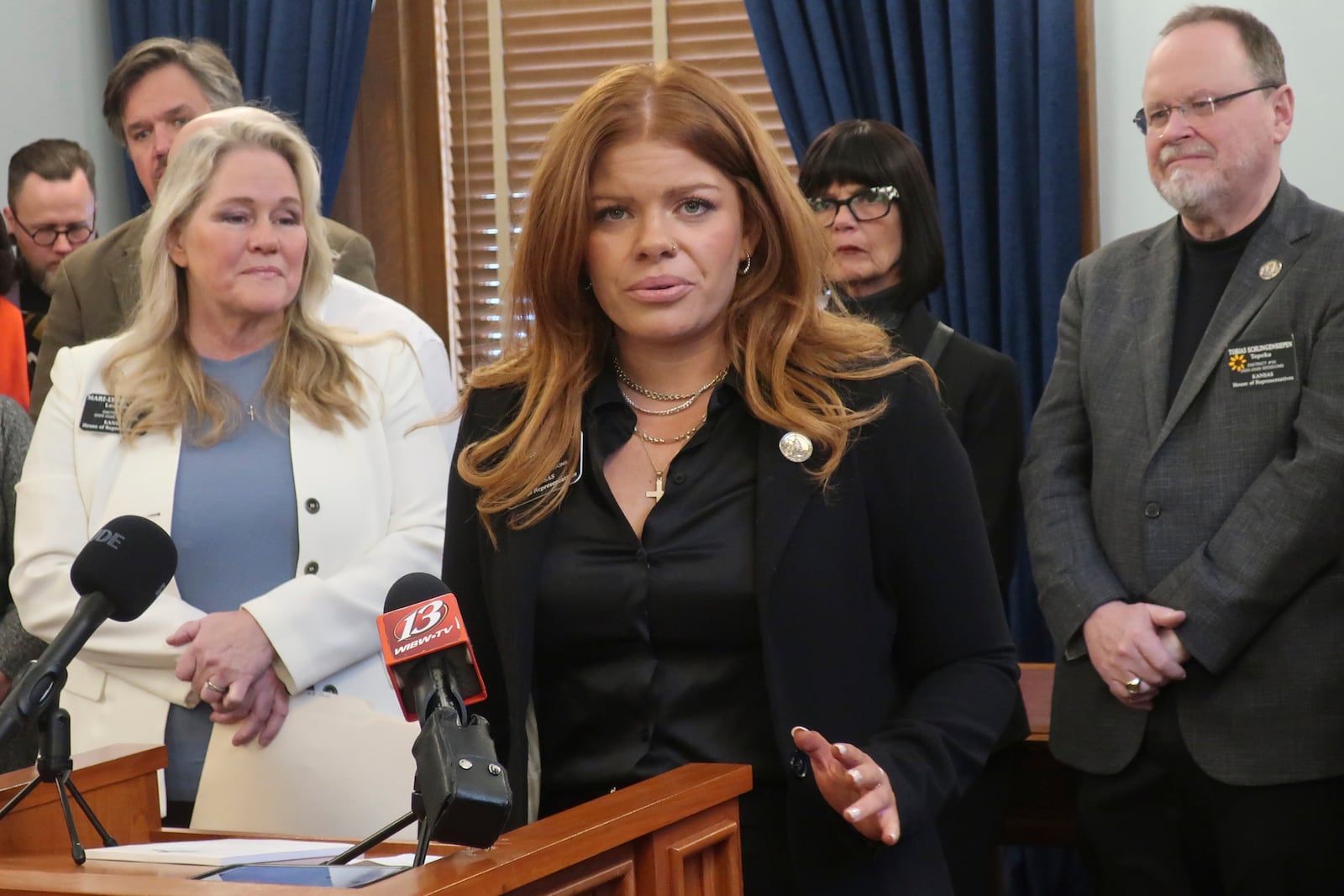 Kansas Rep. Alexis Simmons, D-Topeka, answers questions during a news conference about her concerns that a lawsuit filed in Texas by state attorneys general could lead to a loss of services for disabled children in schools, Monday, Feb. 17, 2025, at the Statehouse in Topeka, Kan. (AP Photo/John Hanna)