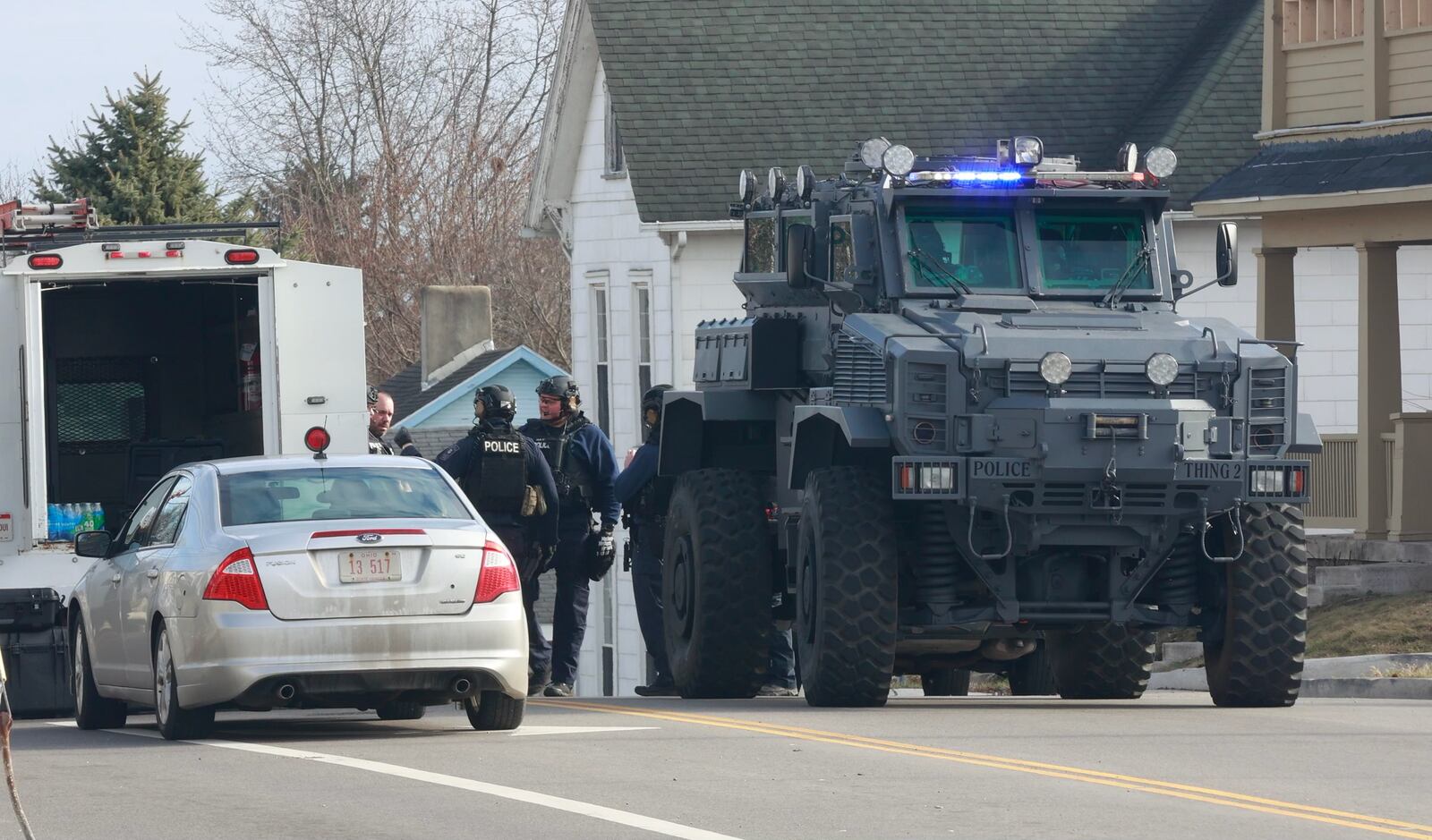 Police are on the scene of an “active SWAT situation” at a house in the 300 block of East McCreight Avenue. STAFF/BILL LACKEY