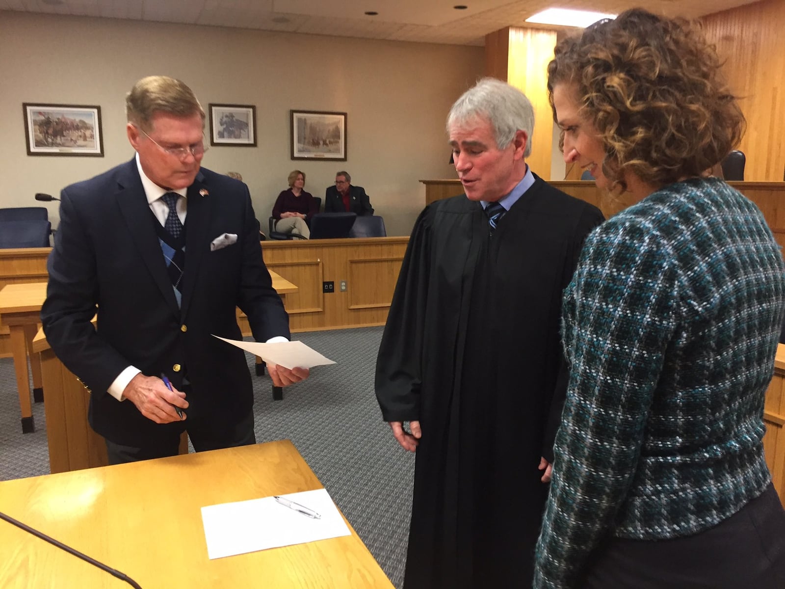 Clark County Judge Richard Carey makes sure new Clark County Commissioners (left) Lowell McGlothin and (right) Melanie Flax Wilt sign their paperwork after they were sworn in as new county commissioners earlier this year. JEFF GUERINI/STAFF