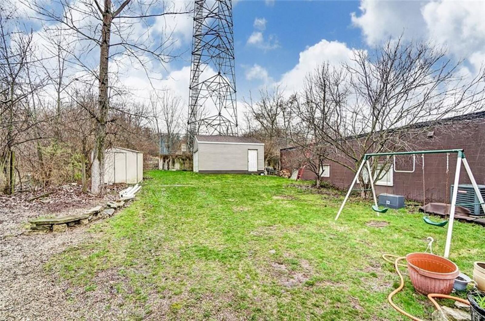 The rear features a detached, 2-car garage and fenced side yard with storage shed. CONTRIBUTED PHOTO