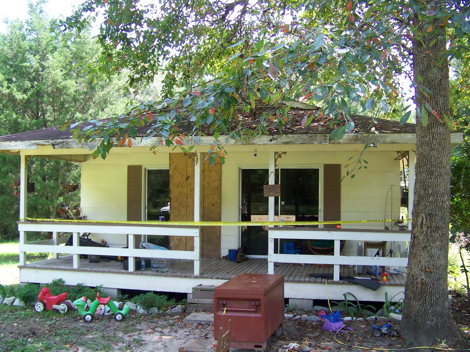 FILE - Crime scene tape marks the home on Jim Platt Road near Citronelle, Ala., Sunday, Aug. 21, 2016, where authorities said five people were killed. (John Sharp/Press-Register via AP, File)