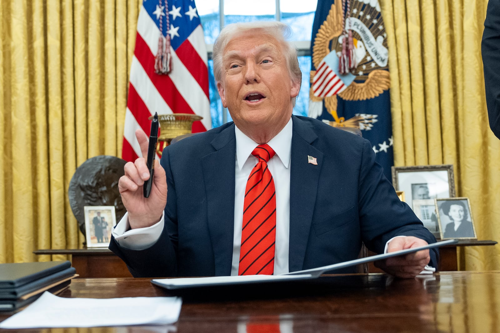 President Donald Trump speaks with reporters as he signs executive orders in the Oval Office at the White House, Monday, Feb. 10, 2025, in Washington. (Photo/Alex Brandon)