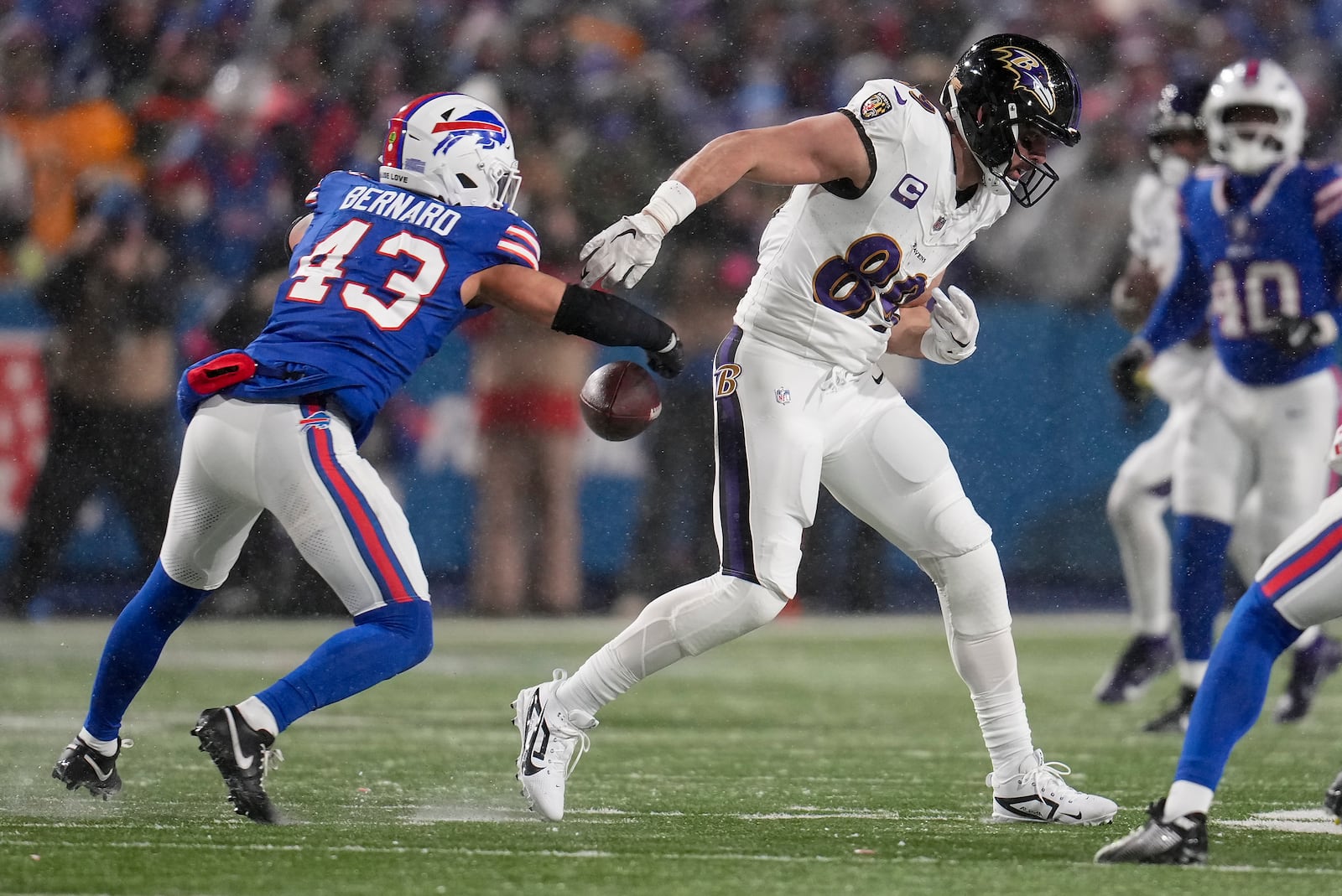 Buffalo Bills linebacker Terrel Bernard (43) strips the ball from Baltimore Ravens tight end Mark Andrews (89) during the fourth quarter of an NFL divisional playoff football game, Sunday, Jan. 19, 2025, in Orchard Park, N.Y. (AP Photo/Gene J. Puskar)