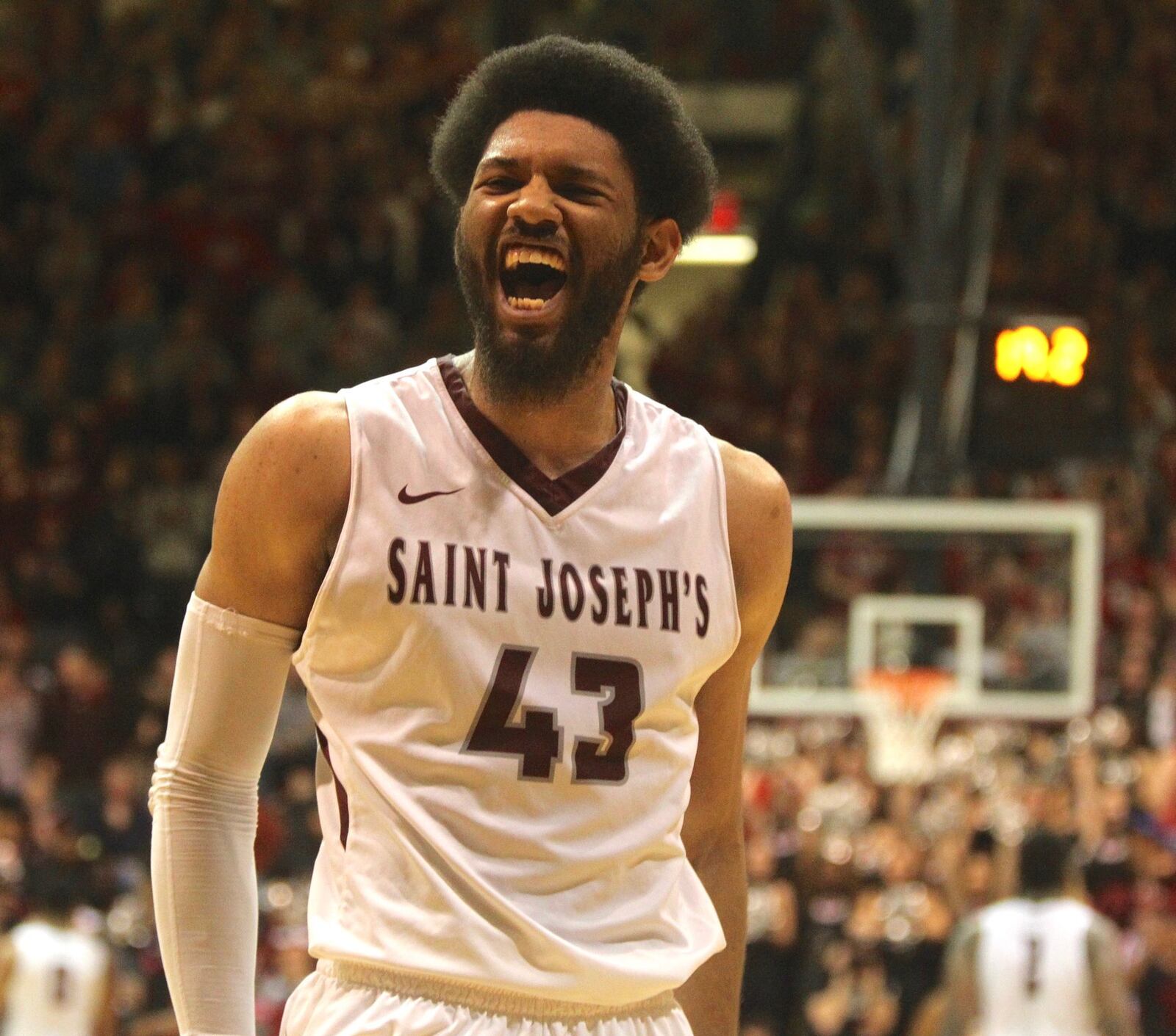 St. Joseph’s DeAndre’ Bembry celebrates in the final seconds of a victory over Dayton on Wednesday, Feb. 17, 2016, at Hagan Arena in Philadelphia. (David Jablonski/Dayton Daily News)