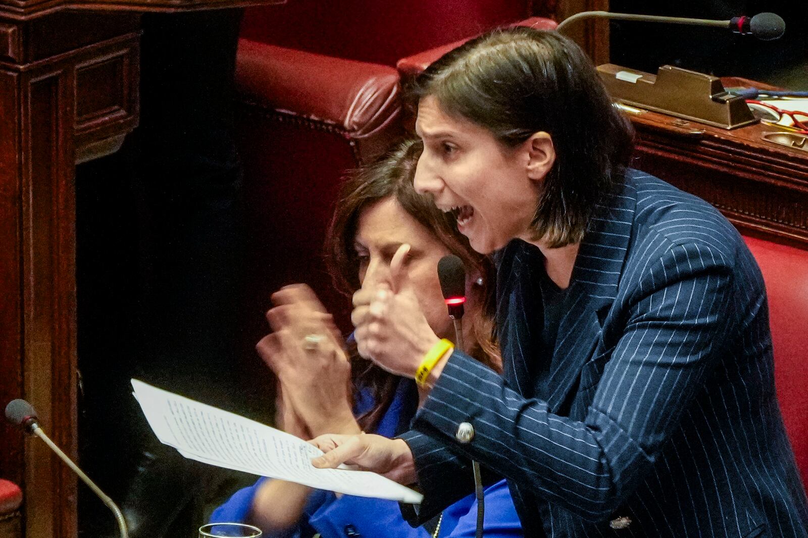 Italian Democratic Party's leader Elly Schlein speaks during a debate in the Italian lower Chamber in Rome, Wednesday, Feb. 5, 2025, over the controversial repatriation, last week, of a Libyan warlord, Ossama Anjiem, also known as Ossama al-Masri, wanted by the International Criminal Court in the Hague, and who had been arrested in Turin, northern Italy. (AP Photo/Gregorio Borgia)