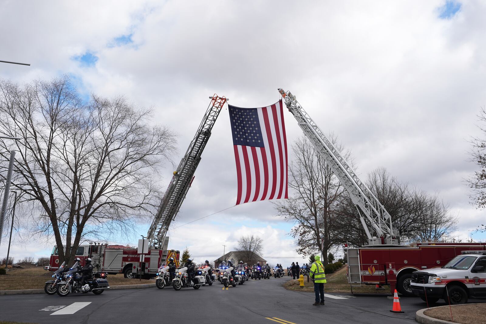 The police procession arrives for the funeral of West York Borough Police Officer Andrew Duarte at Living Word Community Church, in Red Lion, Pa., Friday, Feb. 28, 2025. (AP Photo/Matt Rourke)