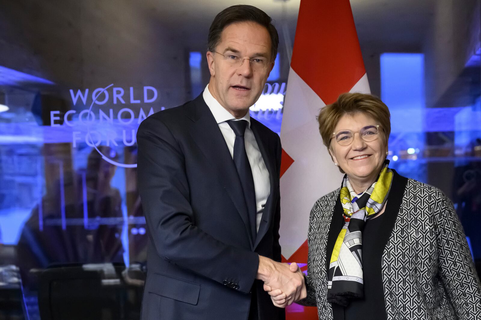 Switzerland's Defense Minister Federal Councillor Viola Amherd, right, shakes hands with NATO Secretary General Mark Rutte, left, prior to a bilateral meeting on the sideline of the Annual Meeting of the World Economic Forum in Davos, Switzerland, Wednesday, Jan. 22, 2025. (Laurent Gillieron/Keystone via AP)