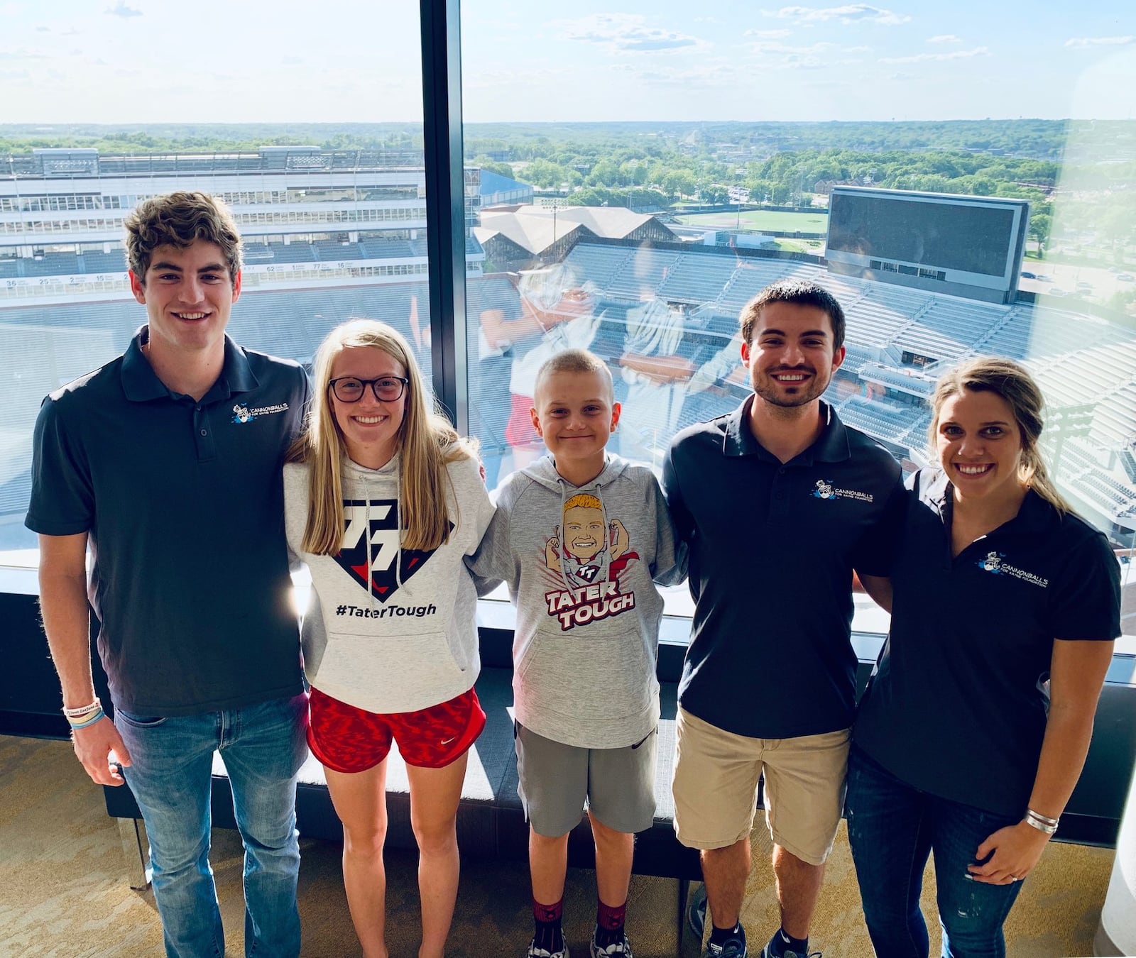 Keagan Finley, Teagan Schaefer, Zach Major and Kendra Crew pose for a photo with Tate Schaefer, who suffers from DIPG, at the University of Iowa’s Stead Family Children’s Hospital on June 10, 2019. Finley, Major and Crew are riding bikes across the country to raise money for DIPG research. Teagan is Tate’s sister. Submitted photo