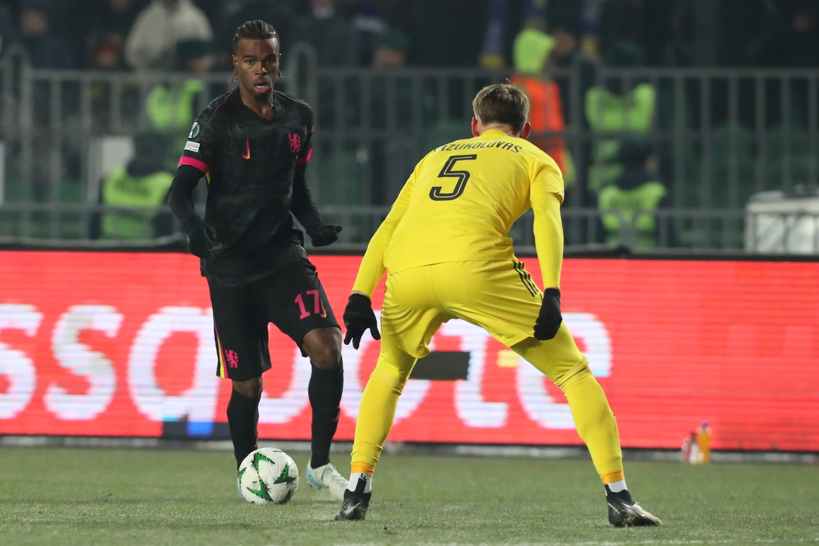 Chelsea's Carney Chukwuemeka, left, fights for the ball with Astana's Kipras Kazukolovas during the Europa Conference League opening phase soccer match between Astana and Chelsea at the Almaty Ortalyk stadium in Almaty, Kazakhstan, Thursday, Dec. 12, 2024. (AP Photo)