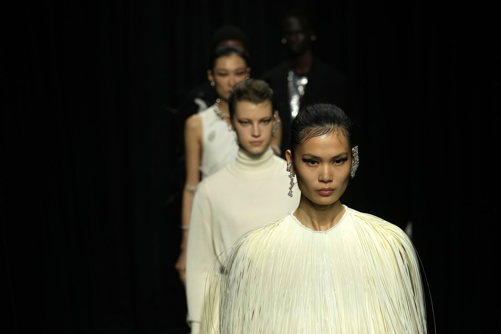 Models wear creations of the Jil Sander Fall/Winter 2025-2026 women's collection presented in Milan, Italy, Wednesday, Feb. 26, 2025. (AP Photo/Antonio Calanni)