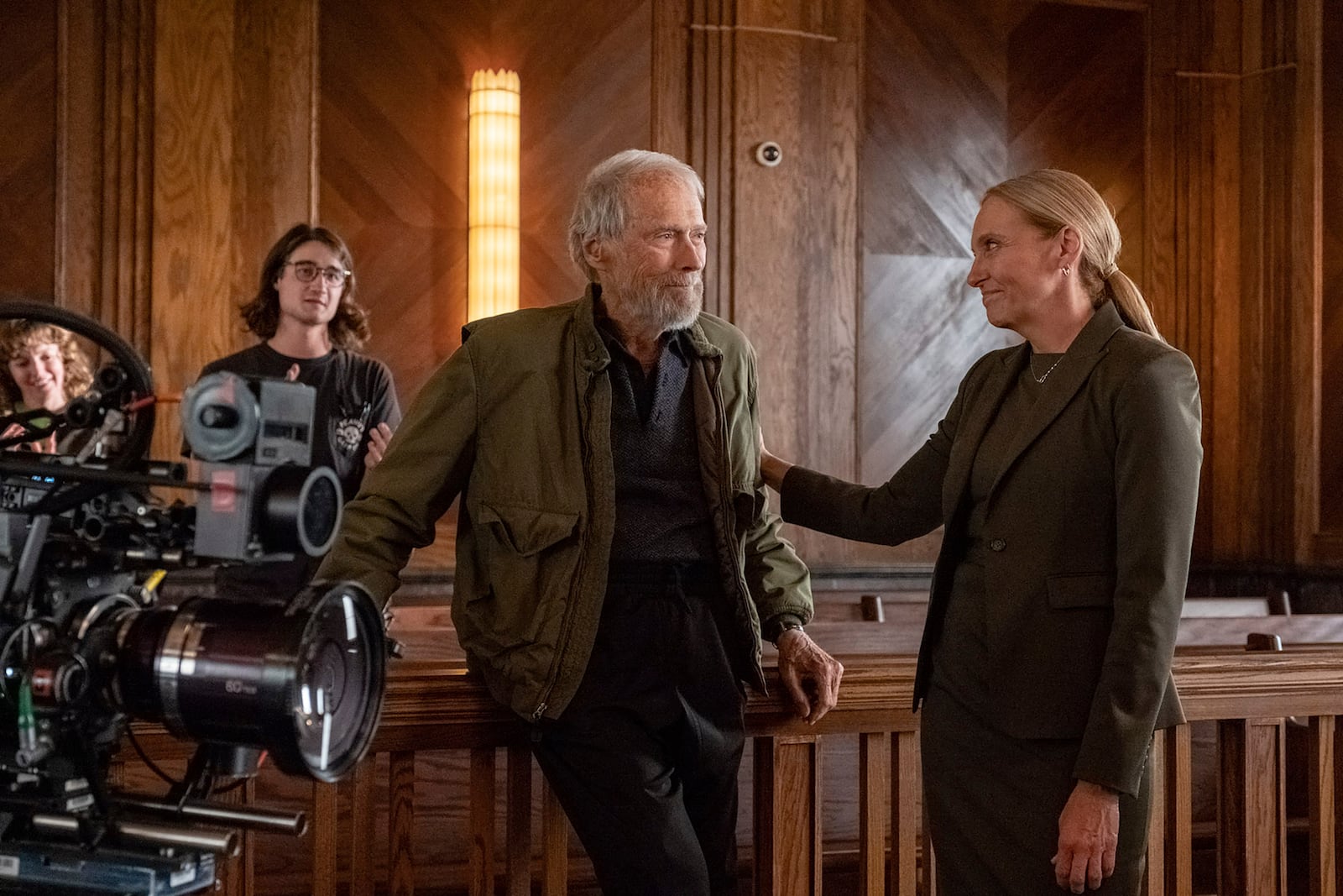 This image released by Warner Bros. Entertainment shows director Clint Eastwood, left, and Toni Collette behind the scenes during production for "Juror #2". (Warner Bros. Entertainment via AP)