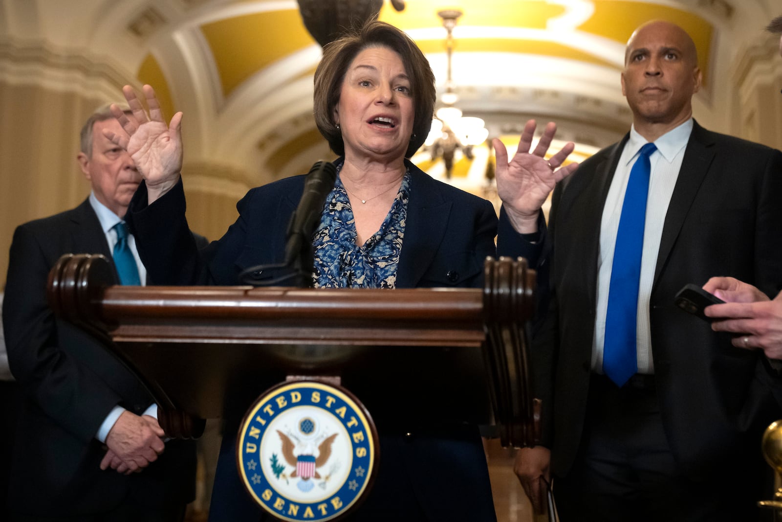 Sen. Amy Klobuchar, D-Minn., speaks to reporters after a Senate policy luncheon on Capitol Hill, Tuesday, March 11, 2025, in Washington. (AP Photo/Mark Schiefelbein)