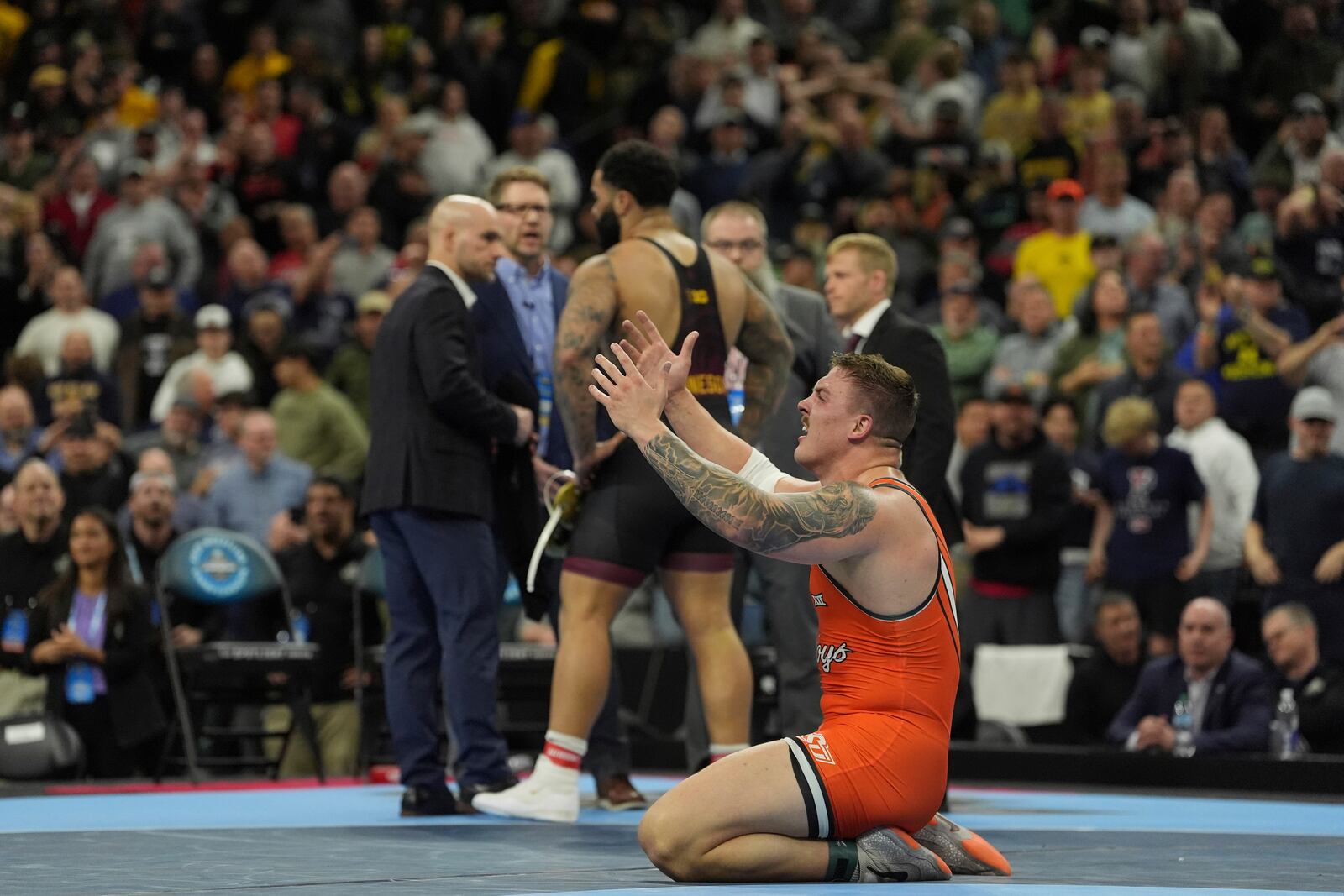 Oklahoma State's Wyatt Hendrickson reacts after defeating Minnesota's Gable Steveson during a 285-pound match in the finals at the NCAA wrestling championship, Saturday, March 22, 2025, in Philadelphia. (AP Photo/Matt Rourke)