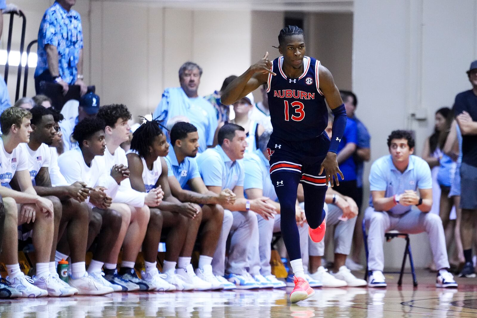 Auburn guard Miles Kelly reacts to scoring against North Carolina during the first half of an NCAA college basketball game at the Maui Invitational Tuesday, Nov. 26, 2024, in Lahaina, Hawaii. (AP Photo/Lindsey Wasson)