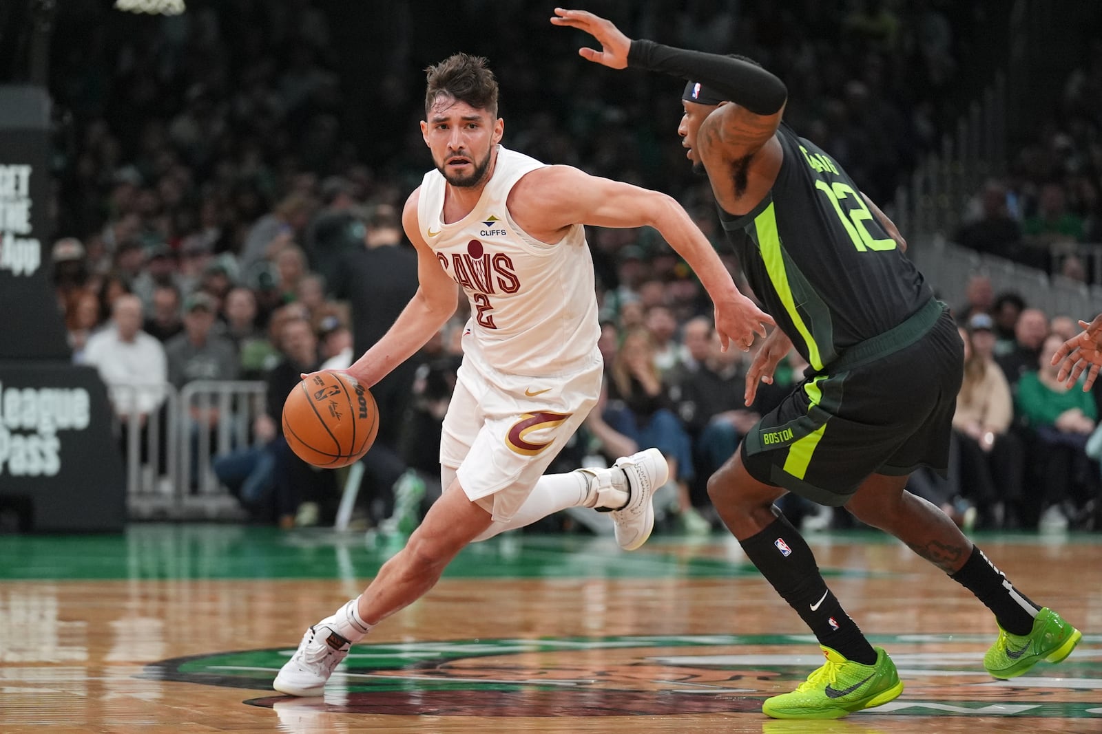 Cleveland Cavaliers guard Ty Jerome (2) drives to the basket against Boston Celtics forward Torrey Craig (12) during the first half of an NBA basketball game, Friday, Feb. 28, 2025, in Boston. (AP Photo/Charles Krupa)